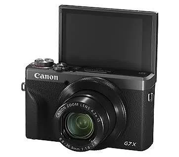 Black Canon G7 X camera with an open flip-up screen and a zoom lens