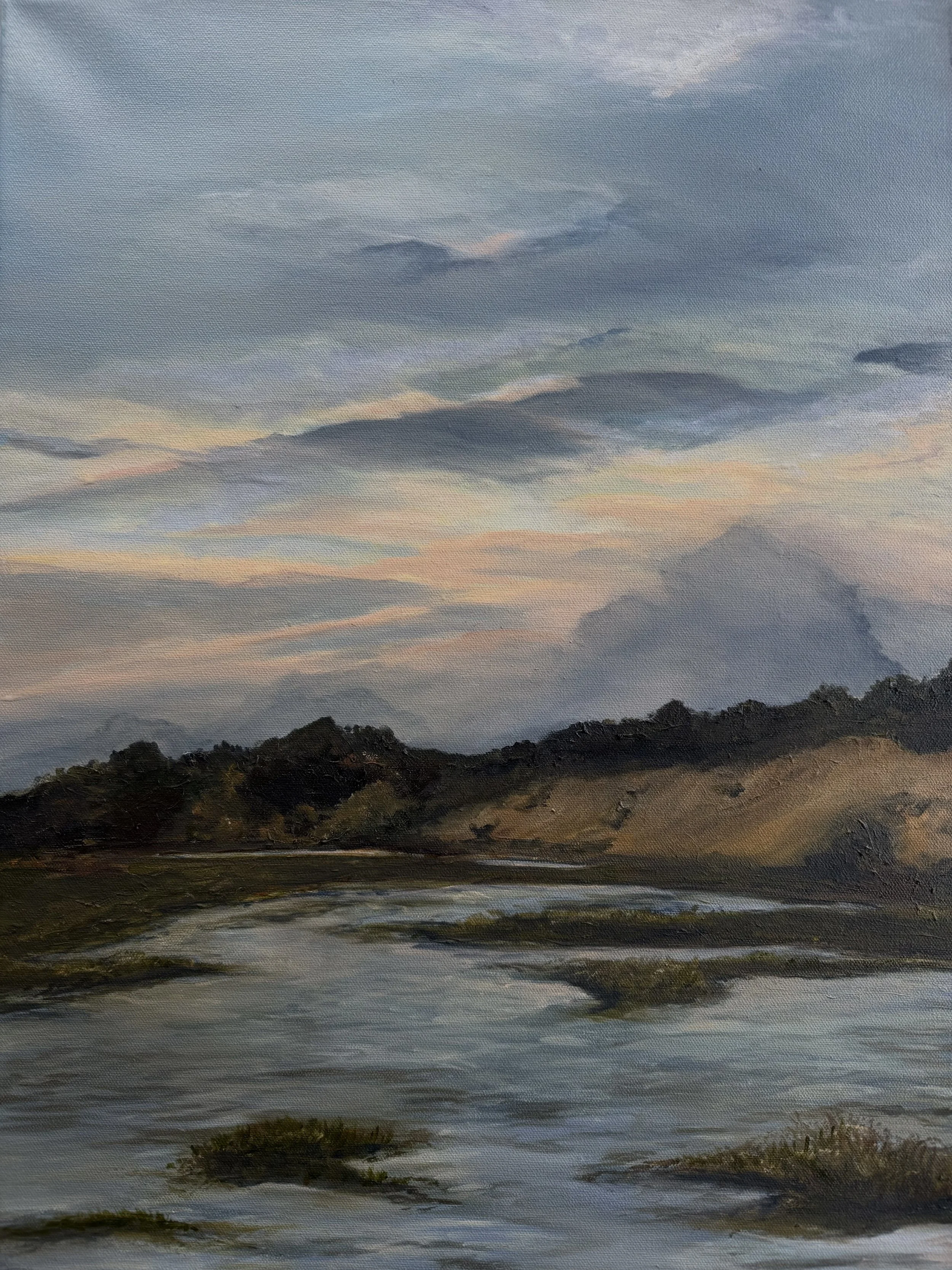 A landscape oil painting of a cloudy sky over a body of water with distant mountains and some trees.
