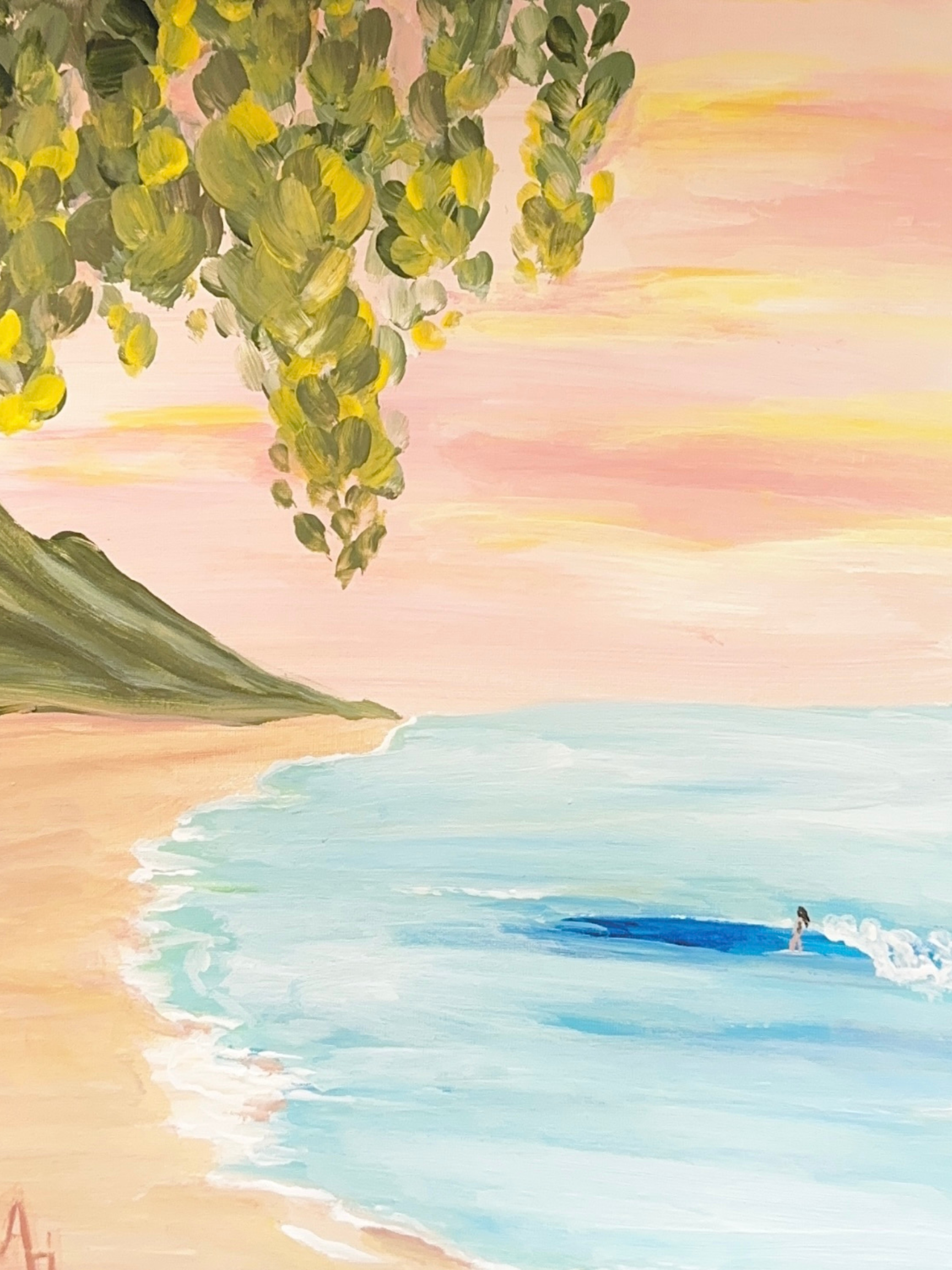 Painting of a sandy beach with a calm ocean, a small wave, and a person standing at the water's edge, with a large tree with green and yellow leaves in the foreground and a colorful sky at sunset. Painting class on kauai instructed