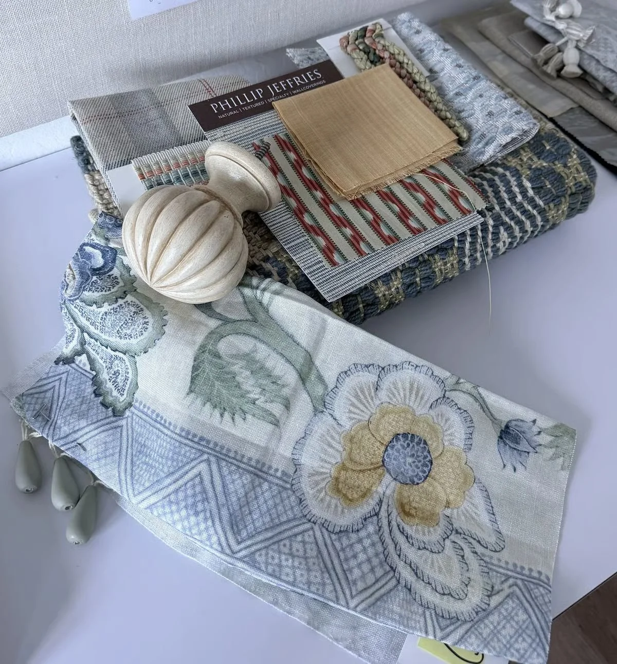 Fabric and trim samples laid out for selection