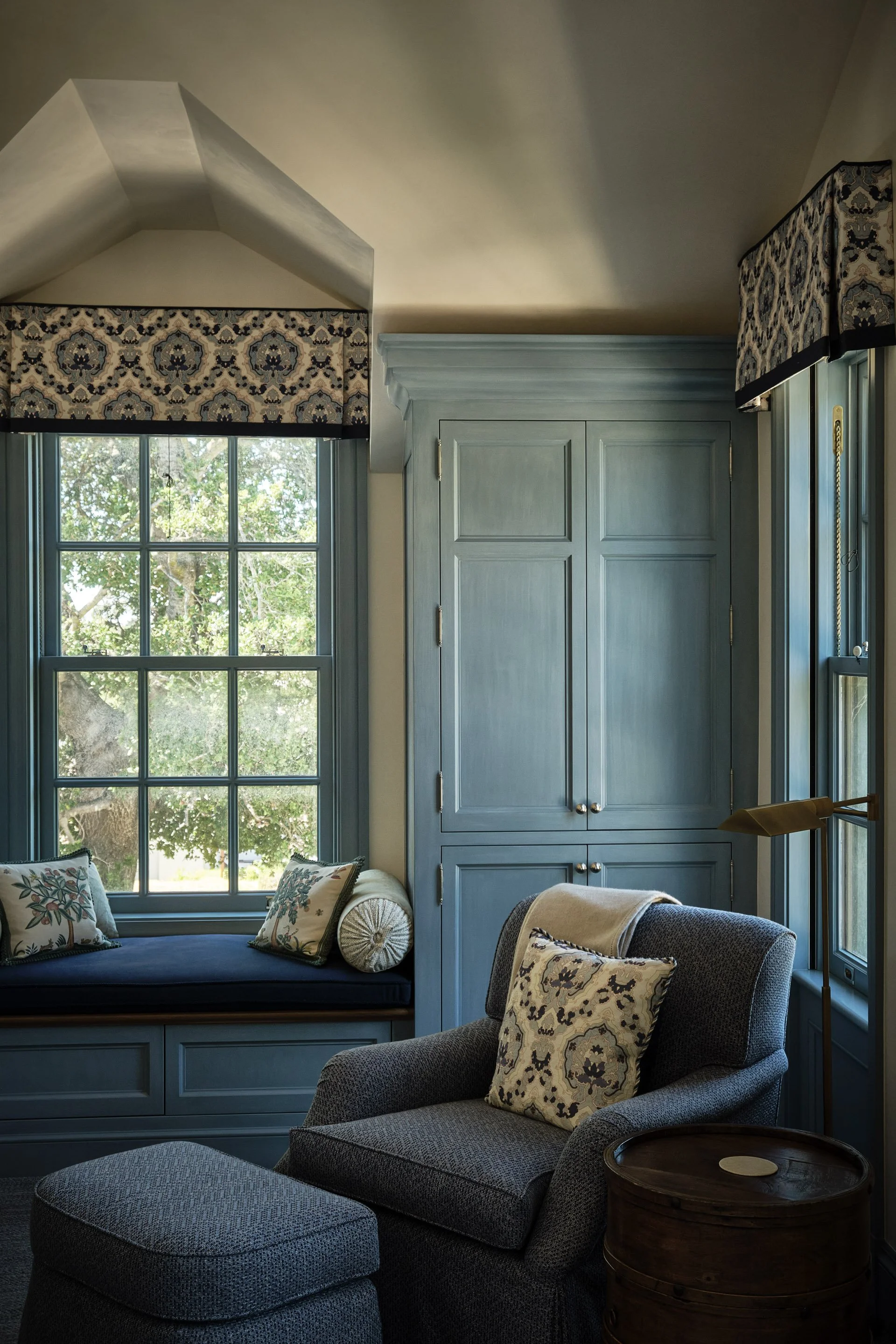 Blue-paneled window seat with cushions and patterned valance, Hillsborough Estate