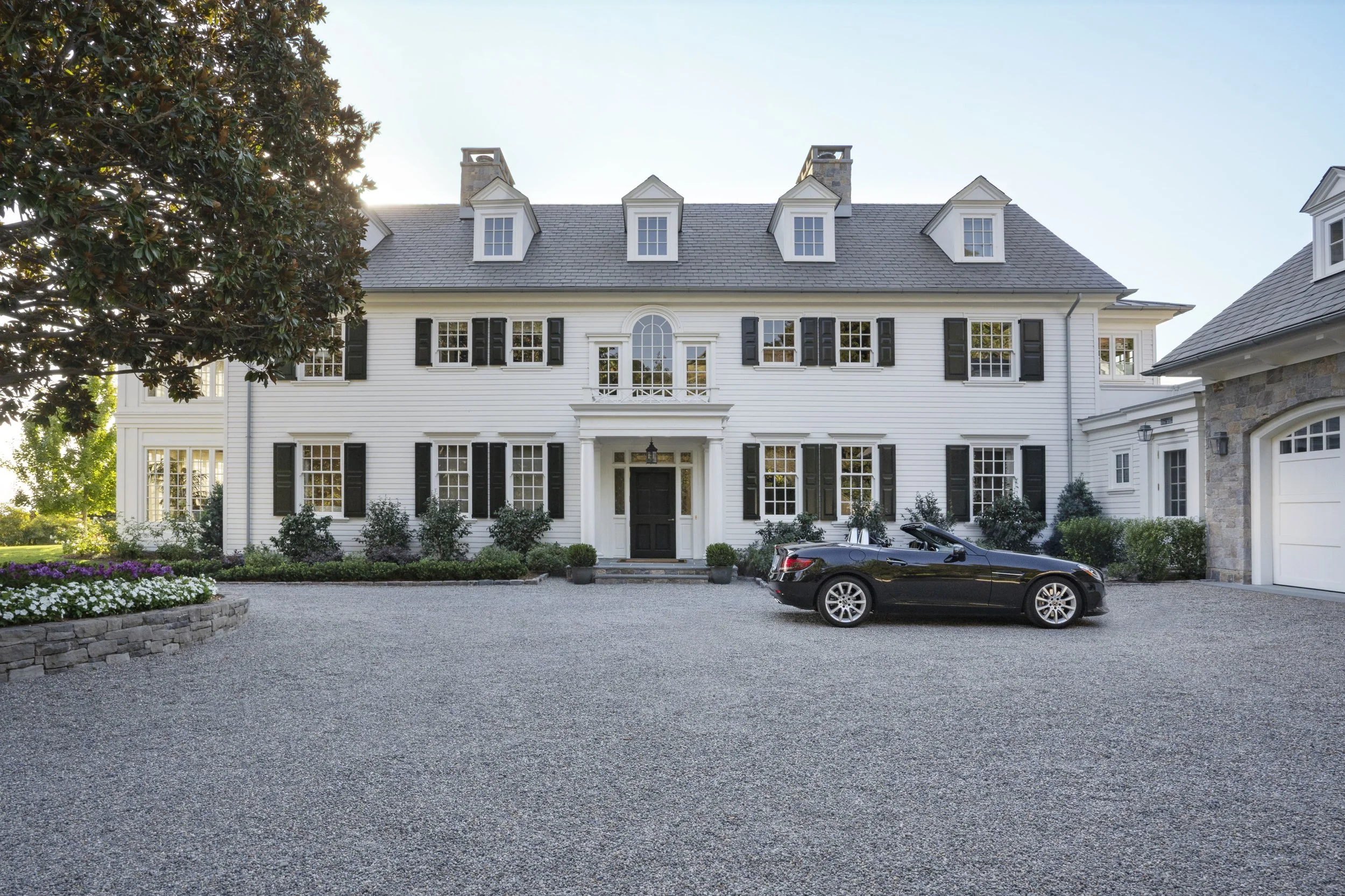 Front facade with gravel drive and dormer windows, East Coast Georgian