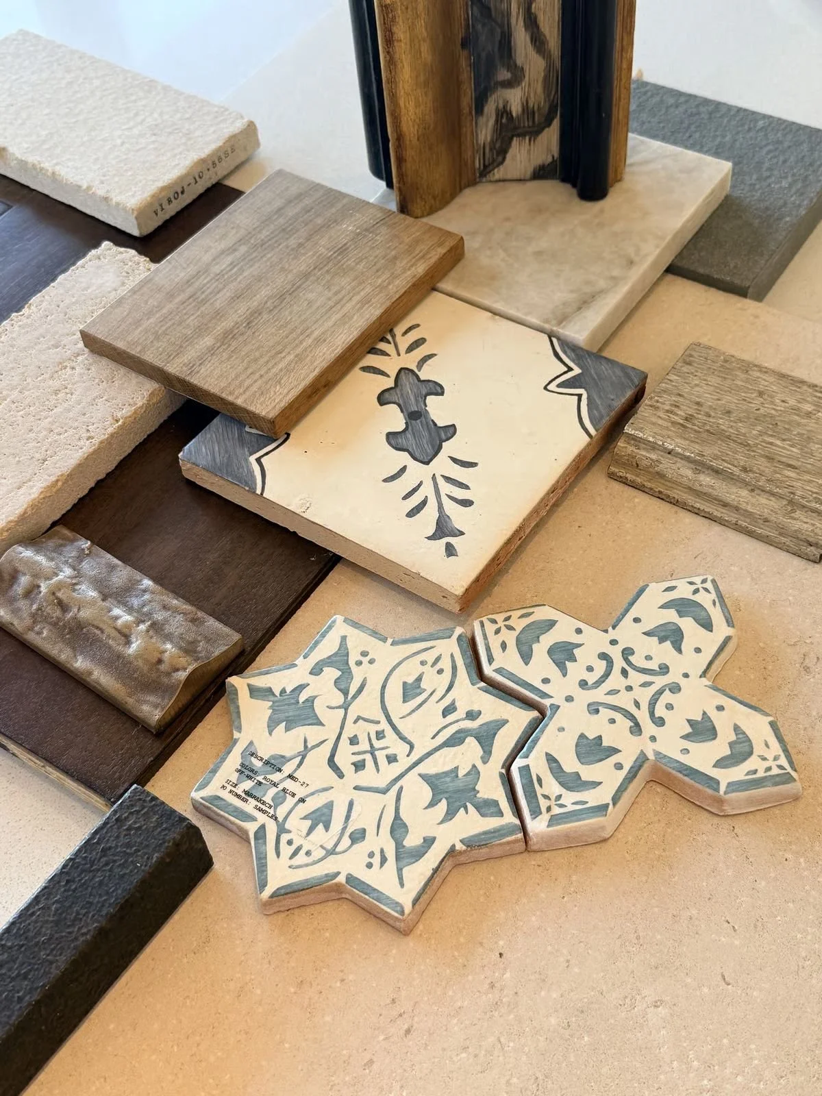Patterned ceramic tile and stone samples arranged for review