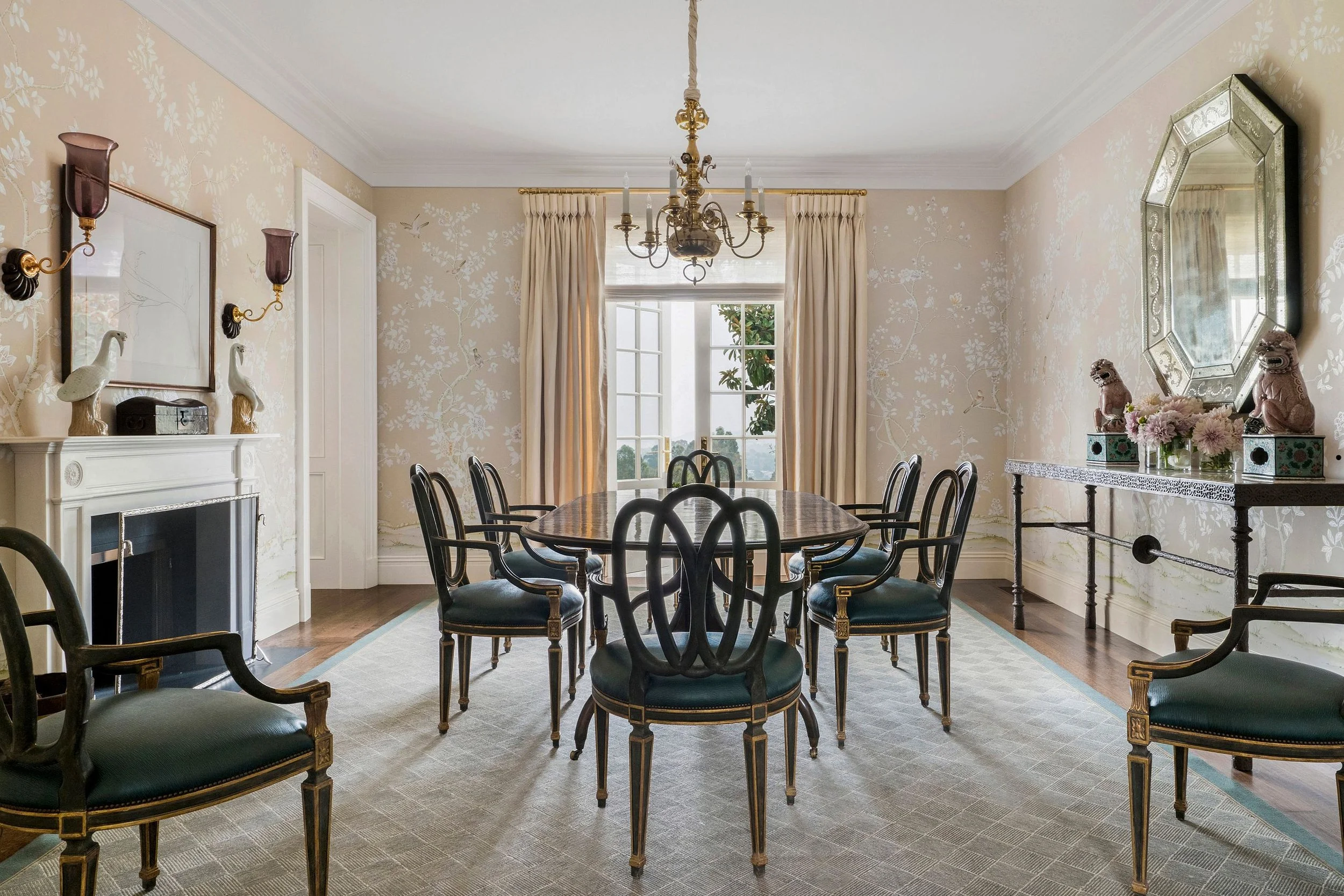 Dining room with black painted chairs, brass chandelier, and textured wallcovering, East Coast Georgian