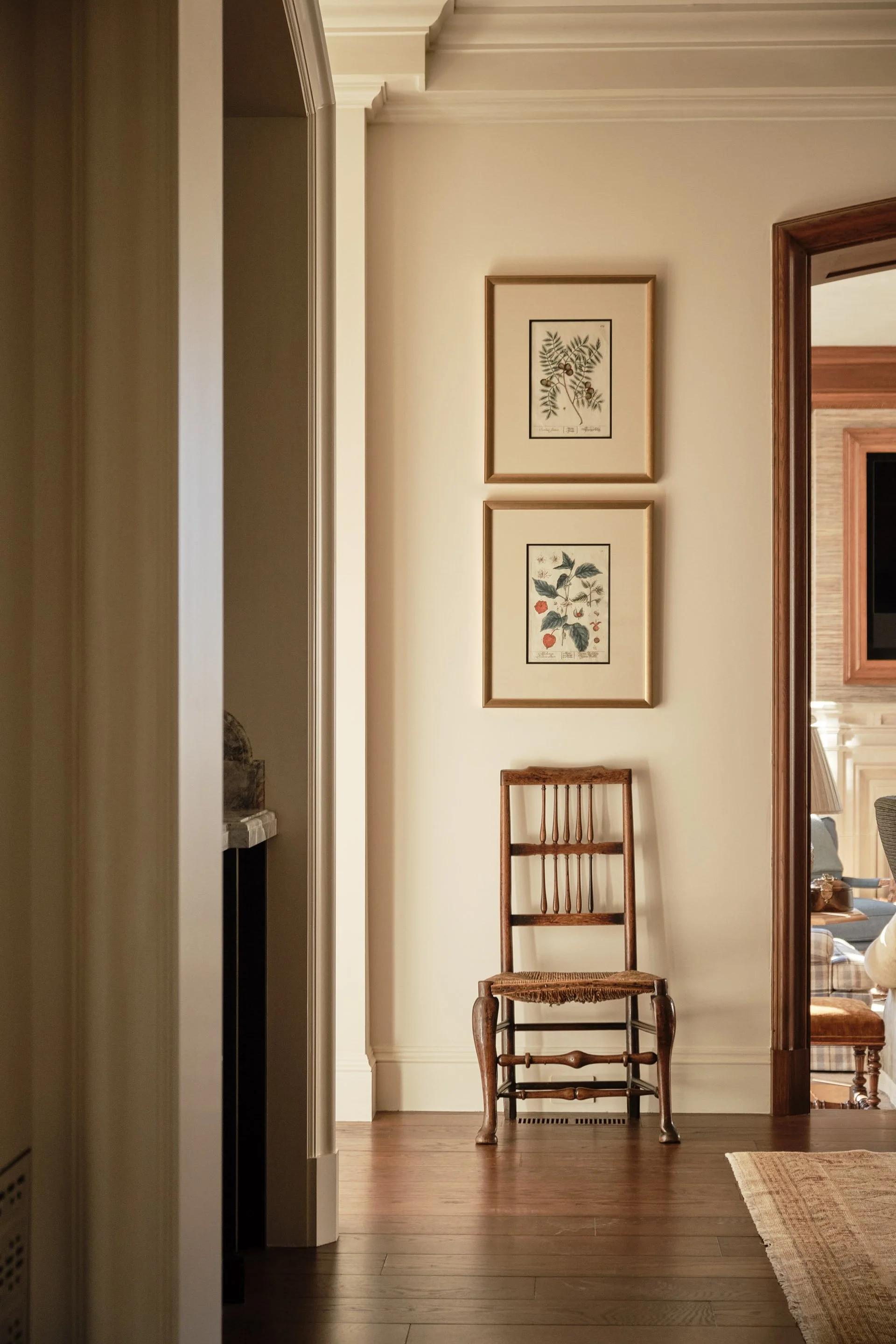 1. Hallway with framed botanical prints and antique side chair, Hillsborough Estate