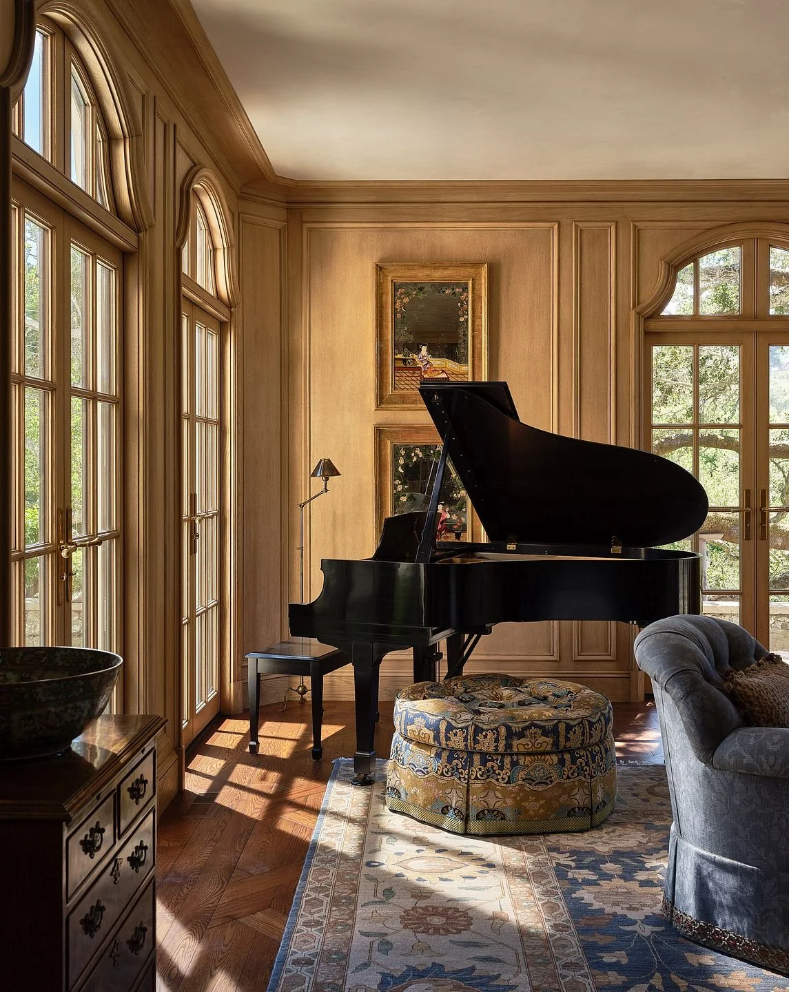 Music room with grand piano and paneled walls in natural light, Hillsborough Estate
