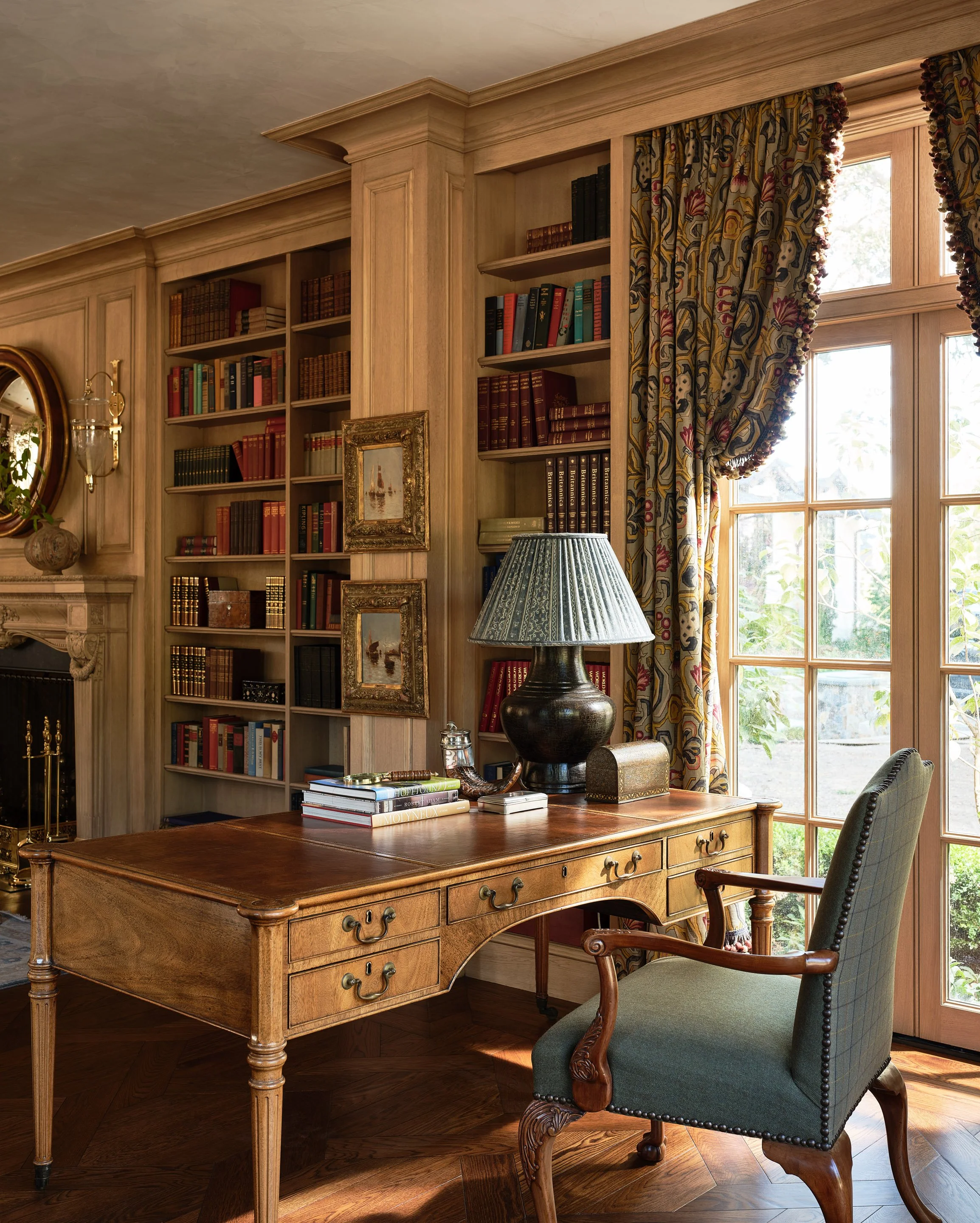 Library with writing desk, floral curtains, and built-in bookshelves, Hillsborough Estate