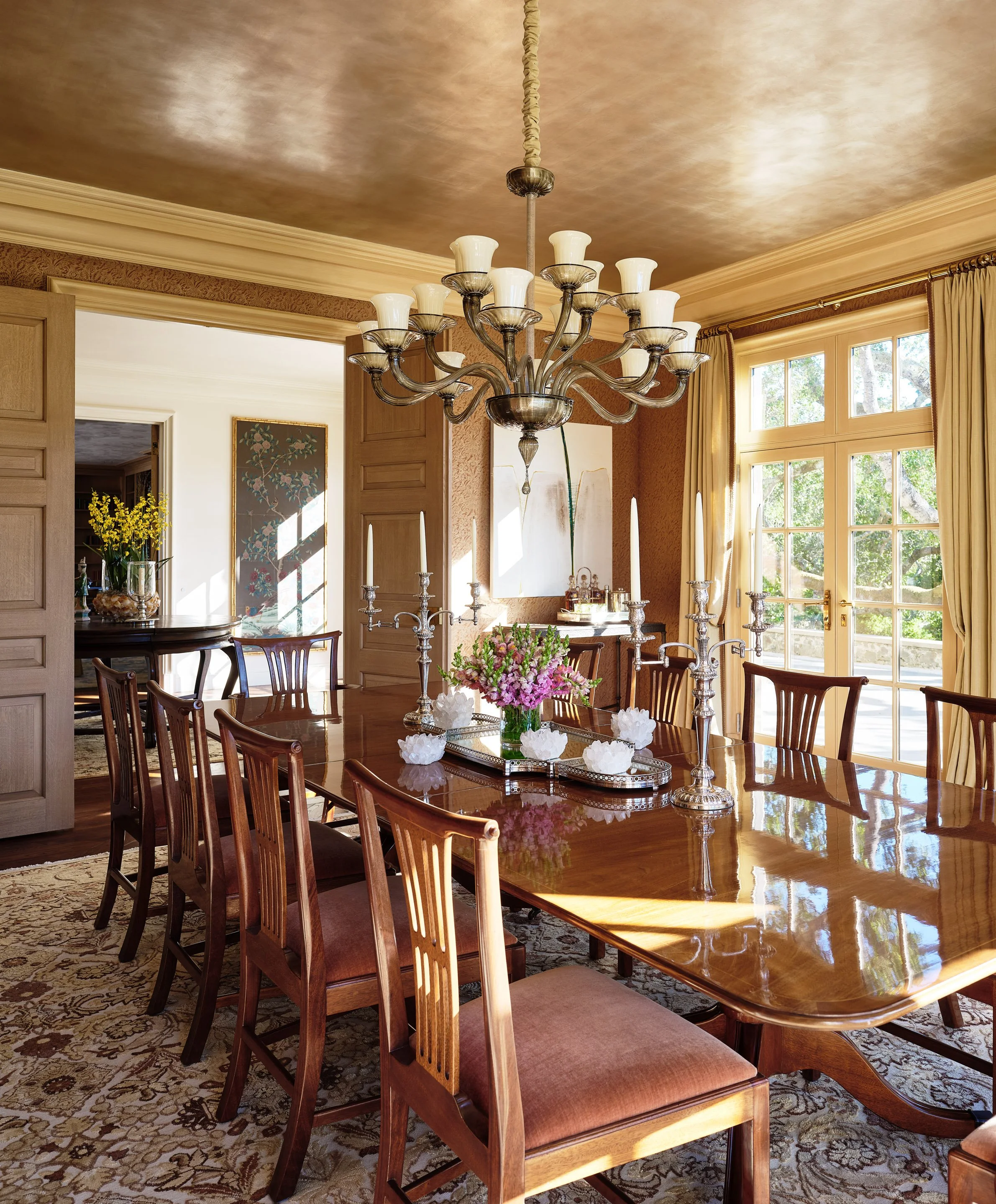 Formal dining room with long mahogany table, chandelier, and French doors, Hillsborough Estate