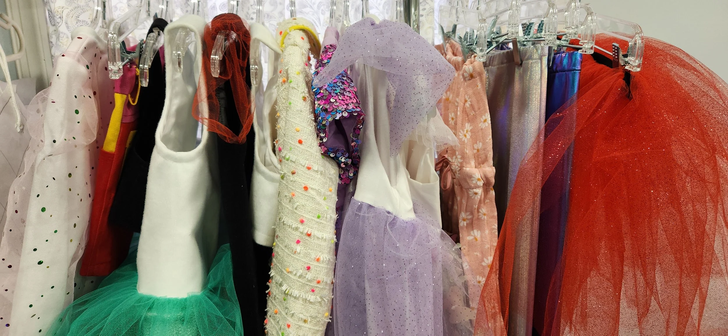 rack of colorful children's clothing