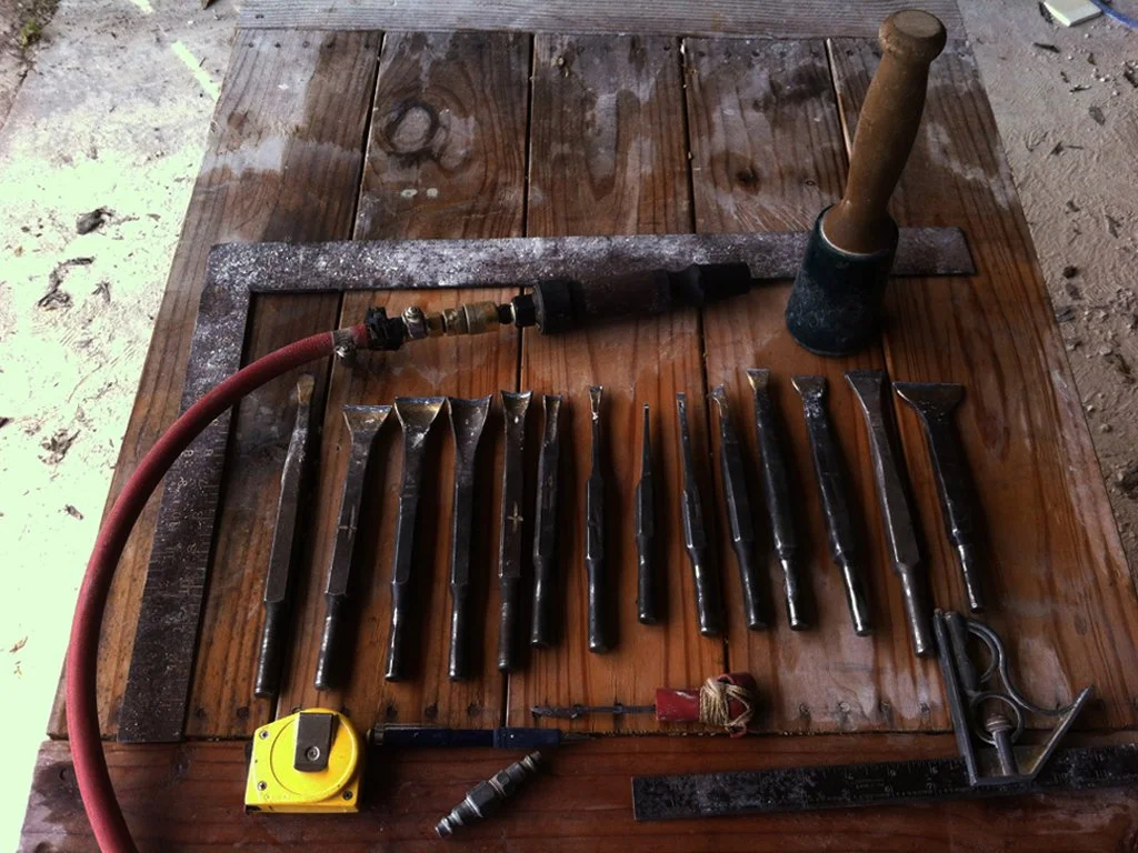 A variety of chisels and stone carving tools