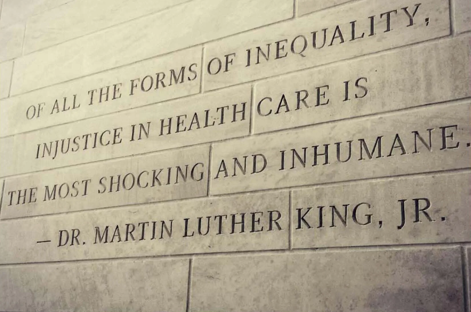 Close-up of a stone wall with engraved quote by Dr. Martin Luther King, Jr.