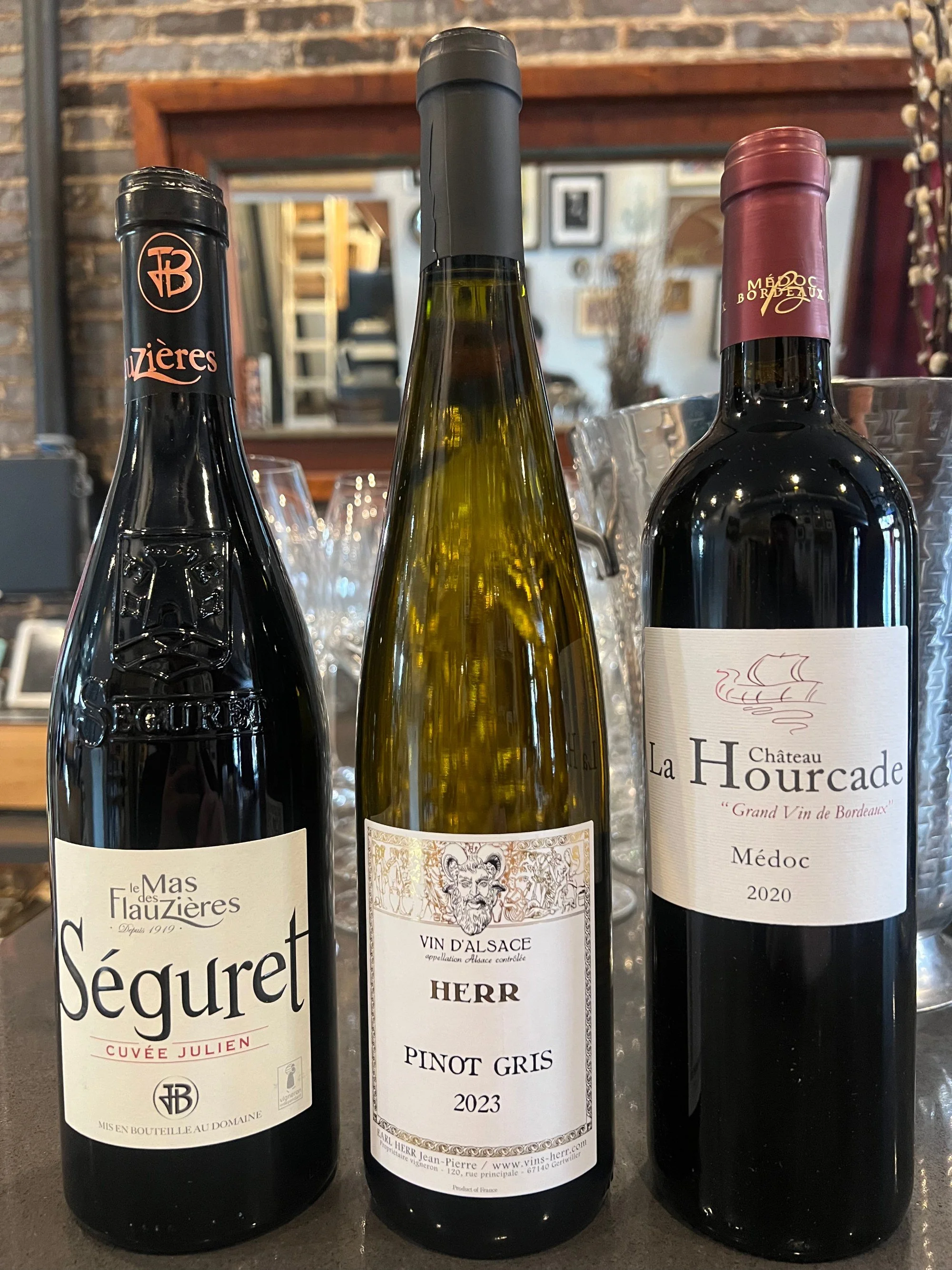 Two reds and a white lined up at Bacchus Kitchen + Wine Bar