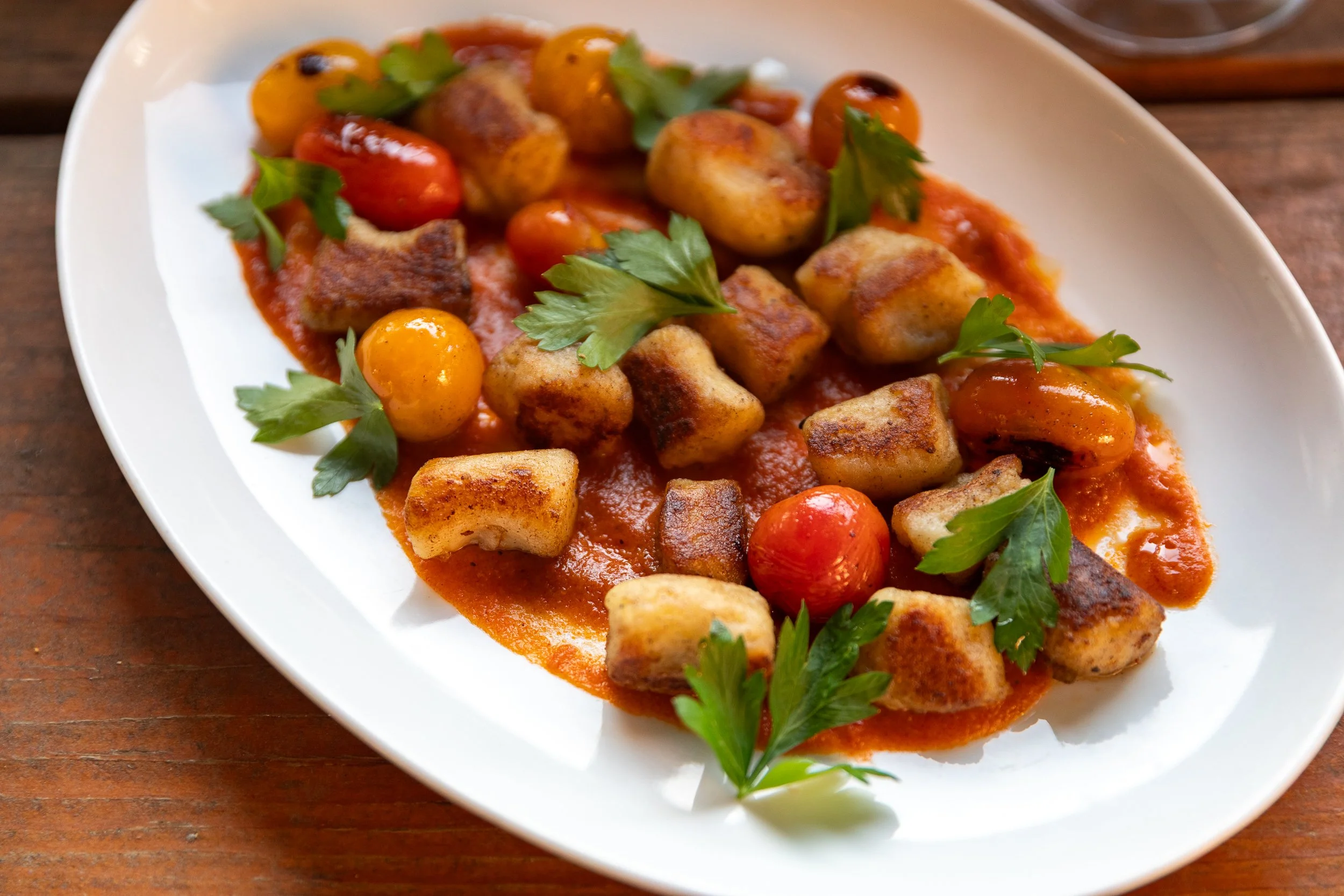 Gnocchi with roasted tomatoes and fresh herbs at Bacchus