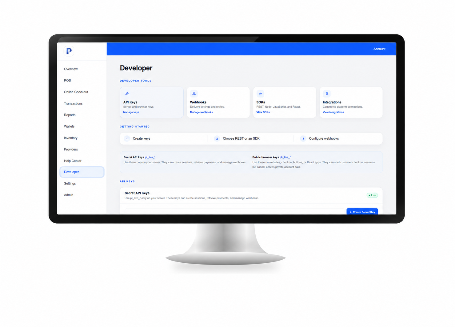Computer monitor displaying a developer dashboard with API Keys, Webhooks, SDKs, and Integrations options on a white background.