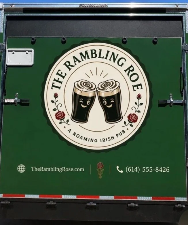Logo for The Rambling Rose, an Irish pub featuring two cartoon beer glasses clinking, with red roses and contact information on a green background.