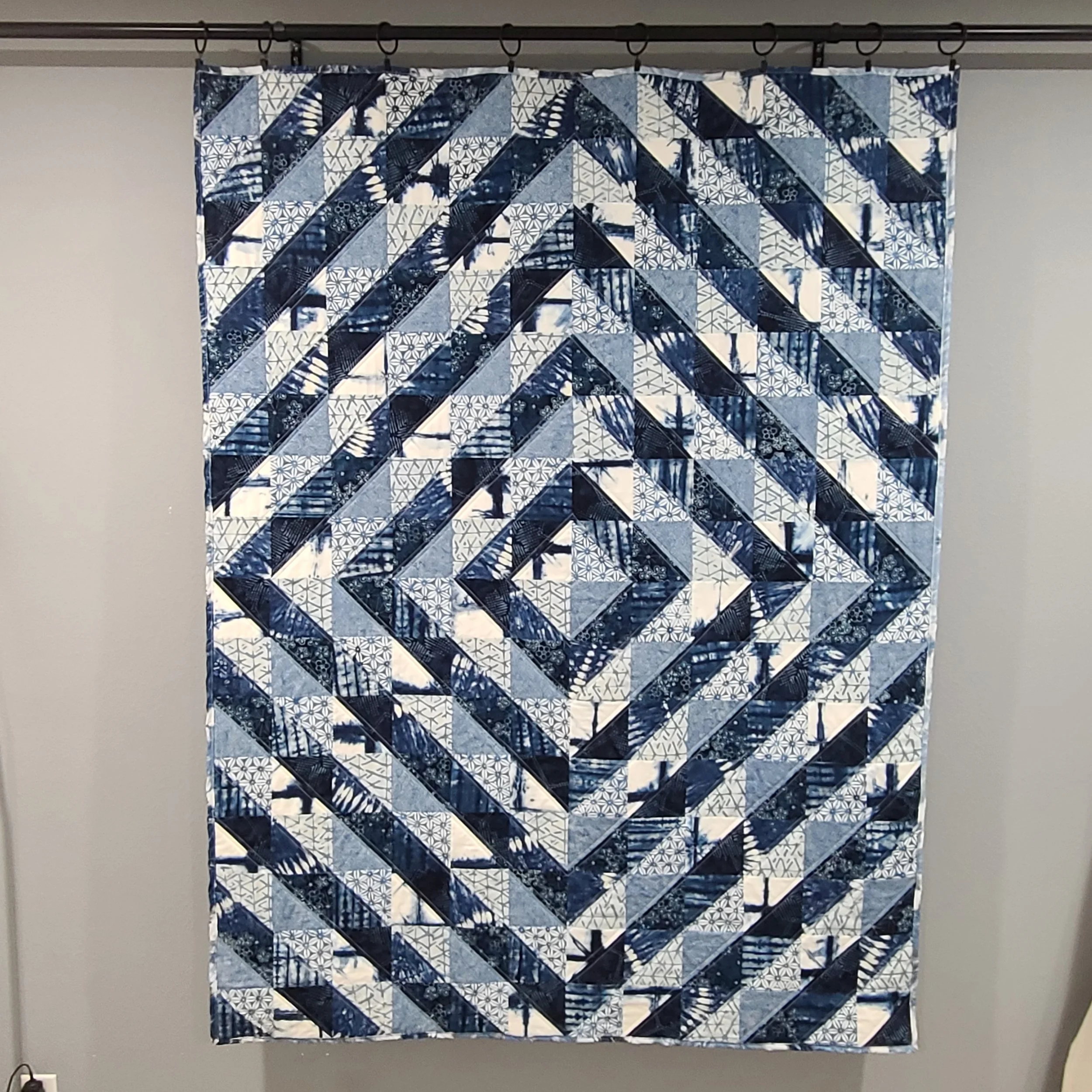 Half square triangle quilt in throw size