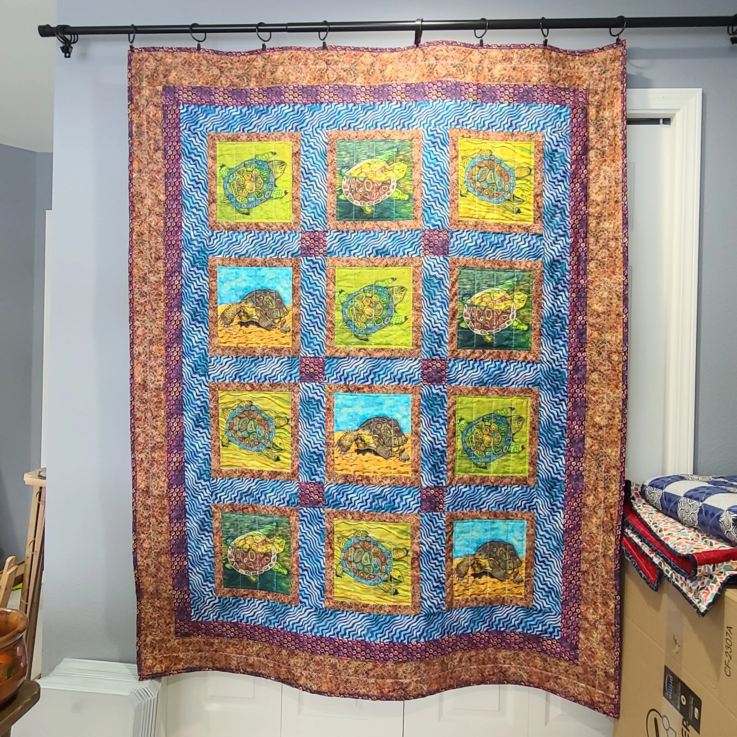 My first time working with panels, a sea turtle themed throw-size quilt