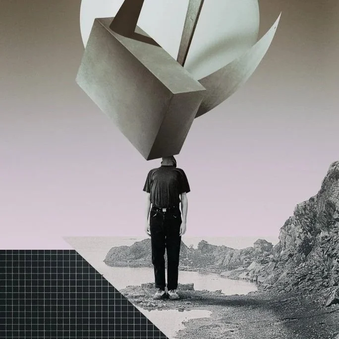 A person standing on a rocky landscape with a large abstract geometric sculpture floating above their head.