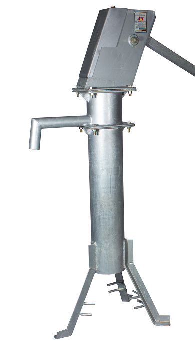 Metal industrial machine with a vertical cylindrical body, a control box on top, and a pipe extending from the side, standing on four angled legs with foot pegs.
