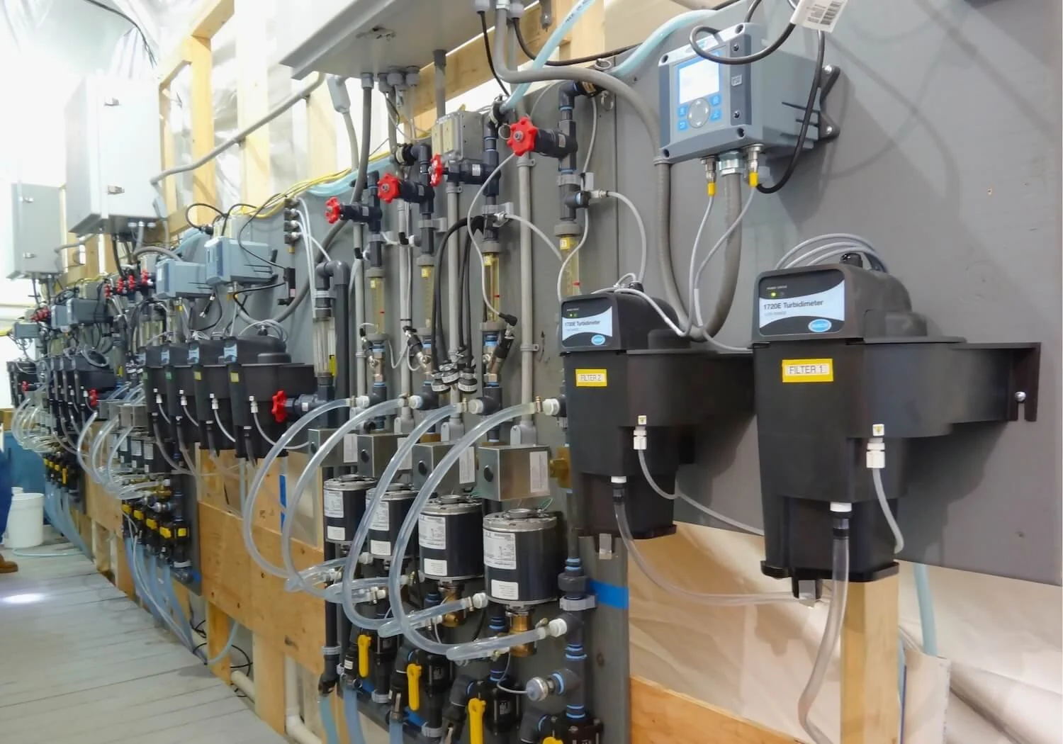 A line-up of the equipment being used to filter water as part of a pilot study.