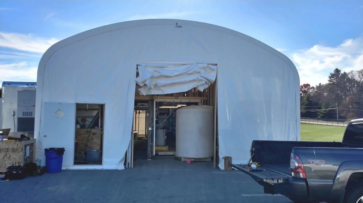 The opening to a water treatment pilot testing tent in New Hampshire outfitted with all the equipment needed to fully analyze and assess the proposed water treatment plan.