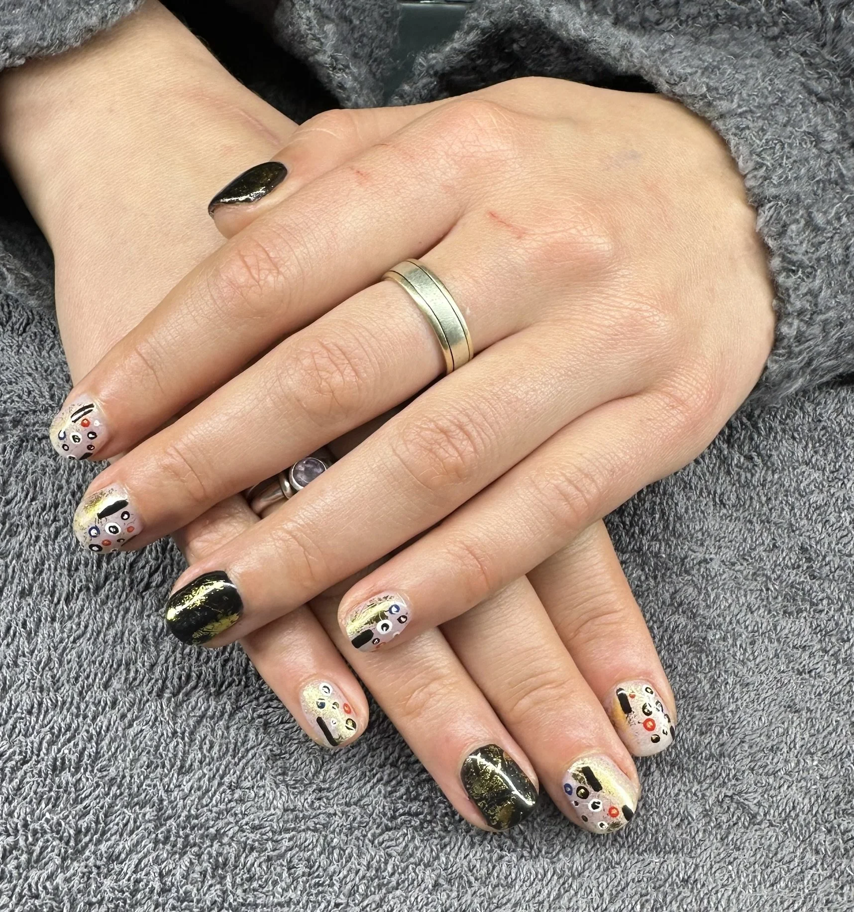 “Bespoke nail art featuring black, gold and floral details on natural nails, created by Roses Kustom Worx in Taupō.”