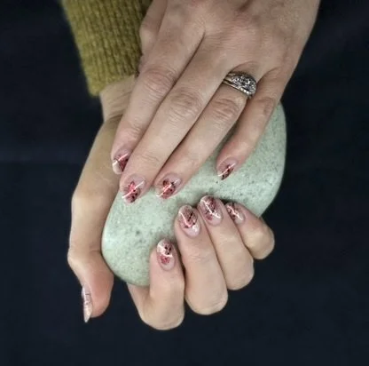 “Soft pink and glitter nail art on natural nails, created by Roses Kustom Worx in Taupō.”