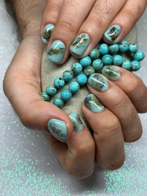 Turquoise and gold marble-inspired nail art with turquoise jewellery, created by Roses Kustom Worx in Taupō.
