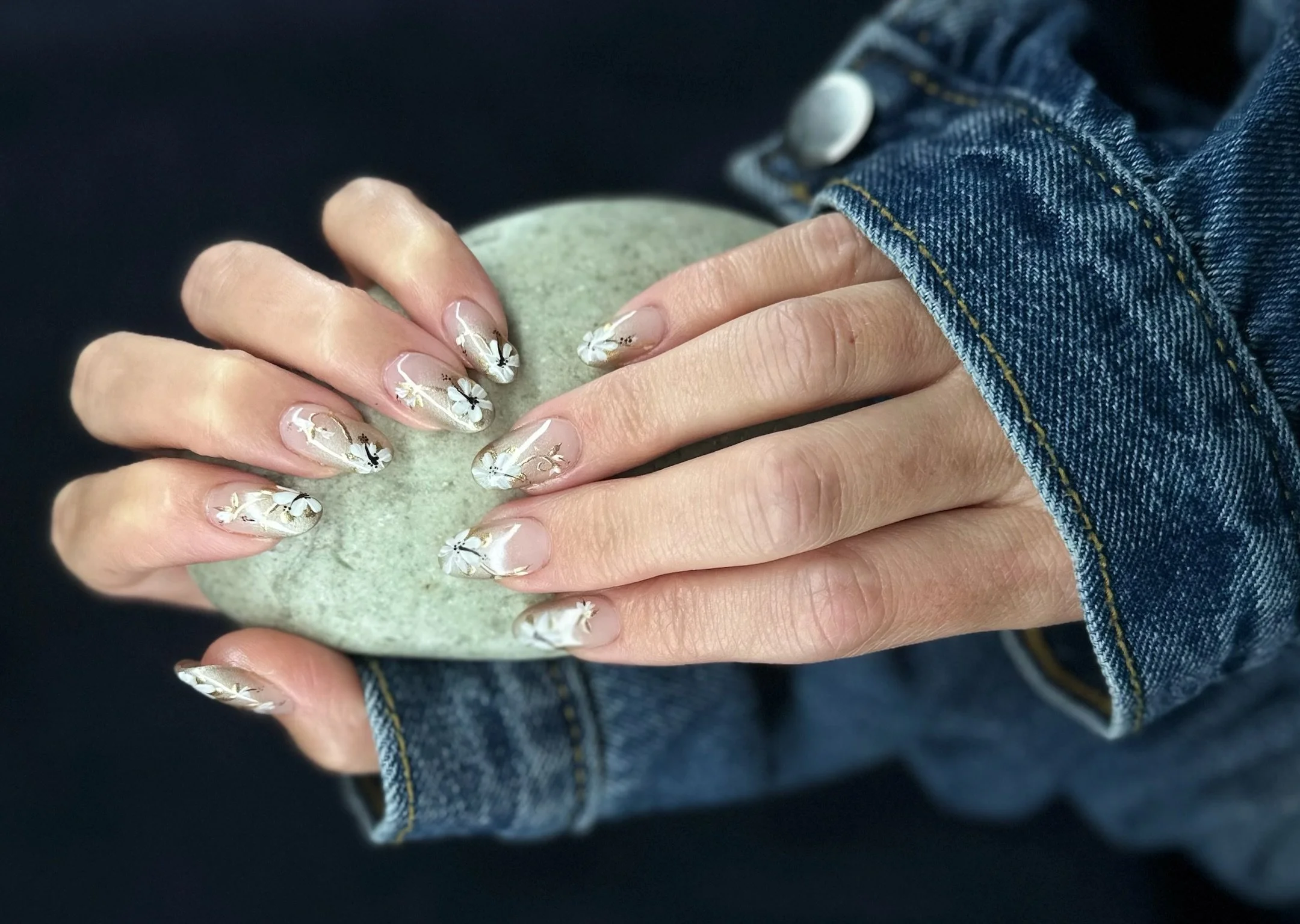 “Soft green and white bespoke nail art on natural nails, created by Roses Kustom Worx in Taupō.”