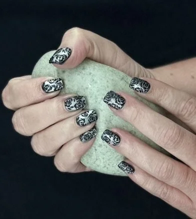 “Black and white patterned nail art on natural nails, created by Roses Kustom Worx in Taupō.”
