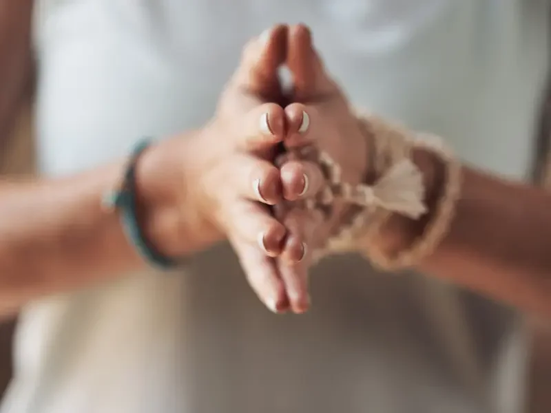 Wellness business promotes mindfulness with a close-up of hands in a meditative prayer position