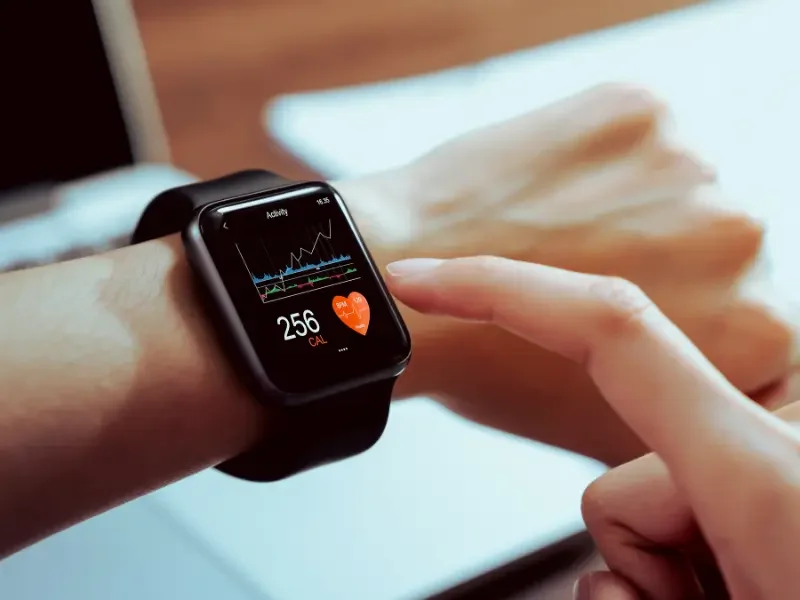 AI in integrative care shown through a smartwatch tracking health data for personalized wellness monitoring