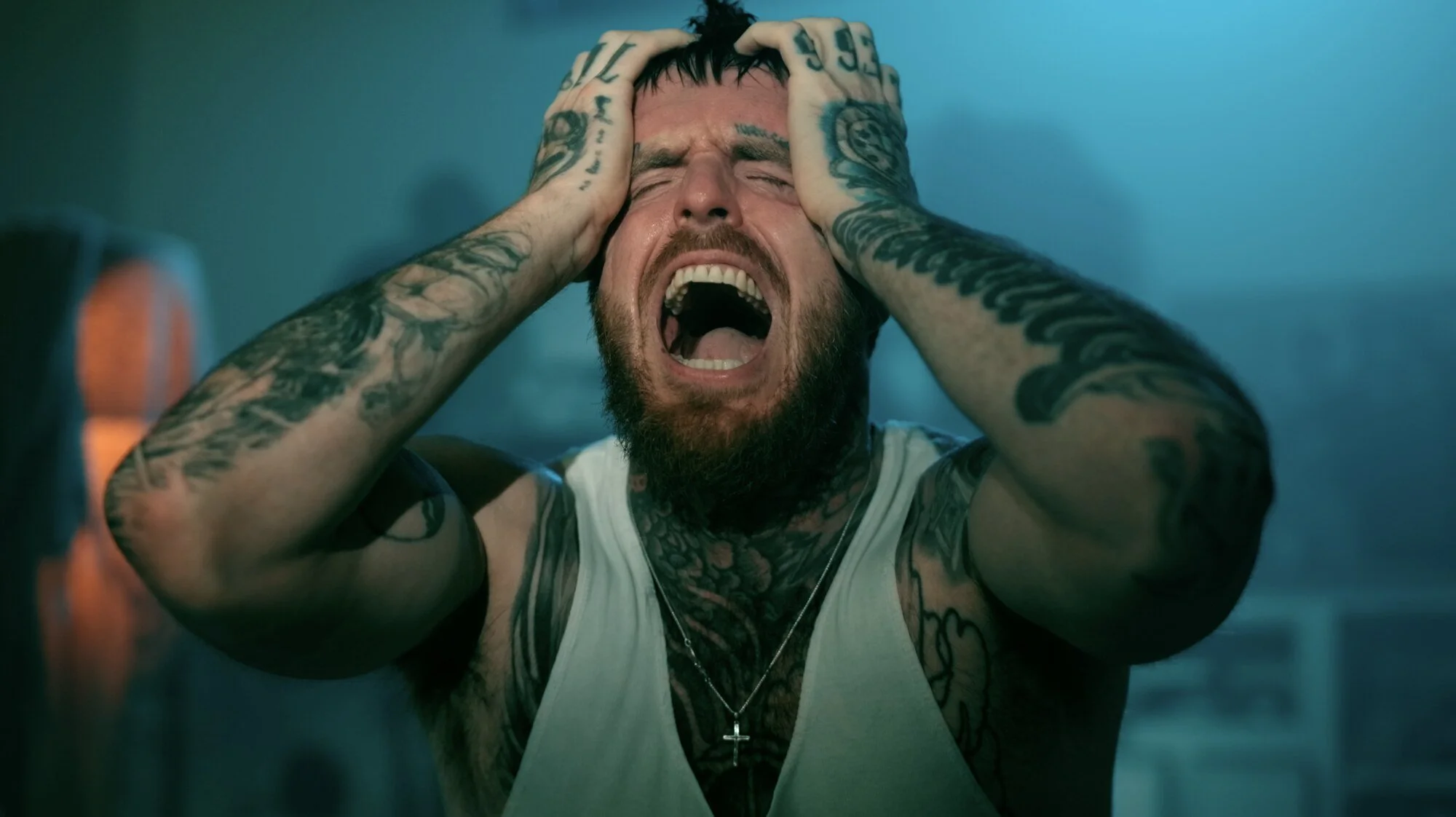 Close-up of rapper 360 screaming in his music video Holding On.