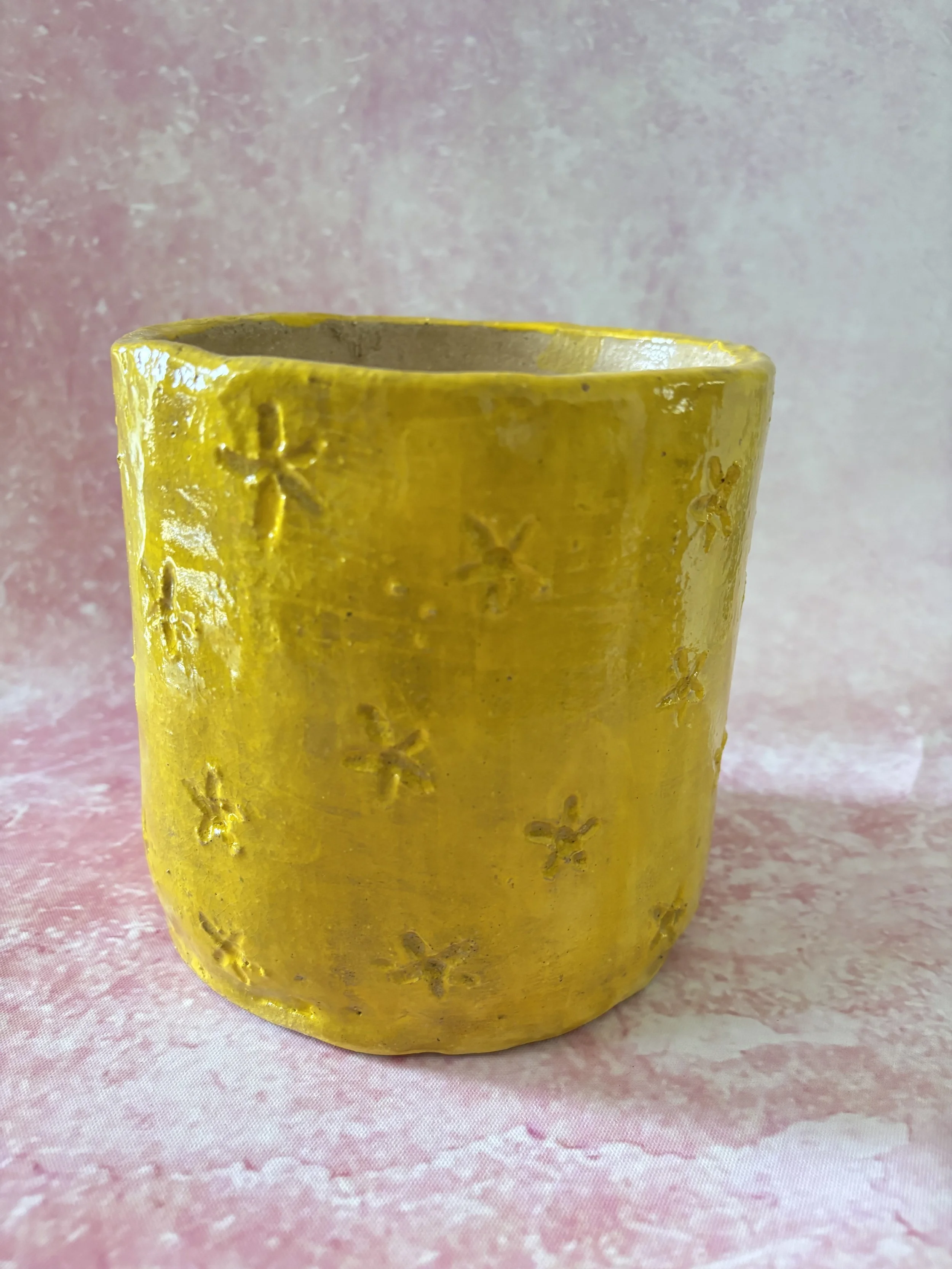 Back View of Yellow Plant Pot with Carved Flowers
