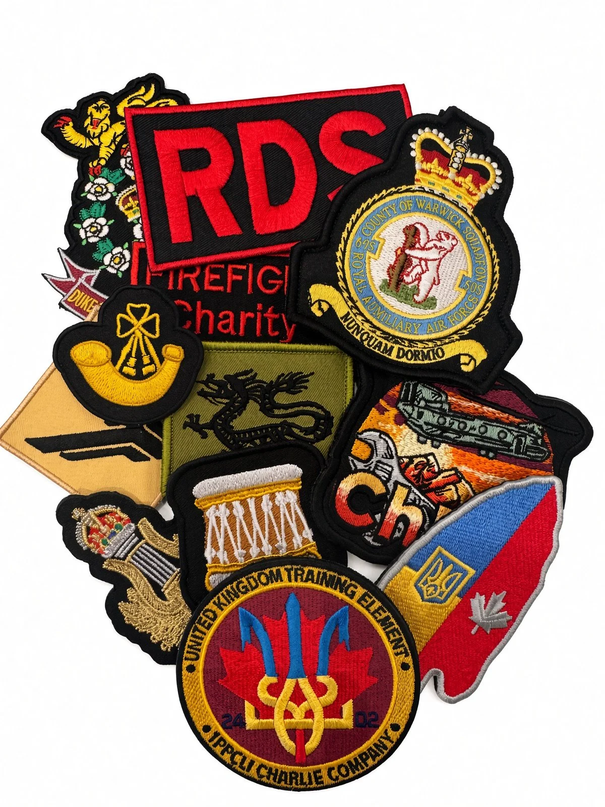 Collection of embroidered patches representing fire departments, military units, and organizations.