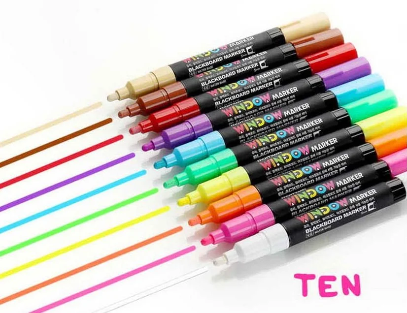 A set of 10 colorful chalk markers arranged in a row, with their corresponding color lines drawn on a white surface and the word "TEN" written in pink.