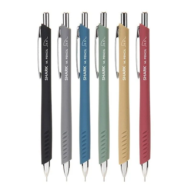 Set of five Shark M pencil pens in black, gray, blue, green, yellow, and red, arranged vertically.