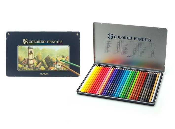 Set of 36 colored pencils in a metal case and a box with a landscape drawing featuring buildings and trees.