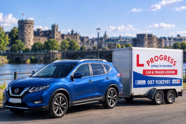 A blue Nissan SUV towing a trailer for Progress School of Motoring, offering car and trailer lessons with contact information on a riverbank in front of a historic castle.