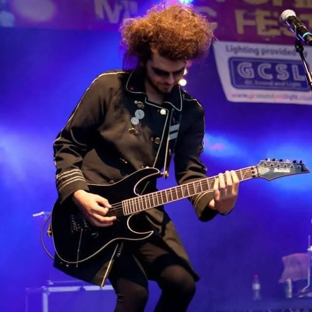 Dan Angelow on stage with Dr and the Medics
