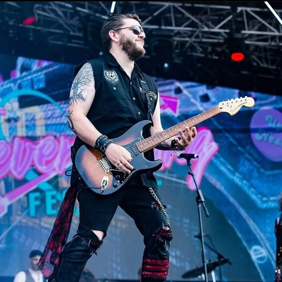 Dan Angelow on stage with Dr and the Medics