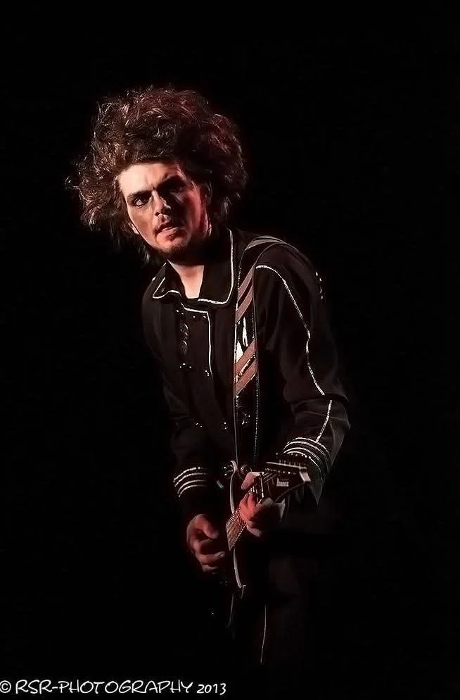 Dan Angelow on stage with Dr and the Medics