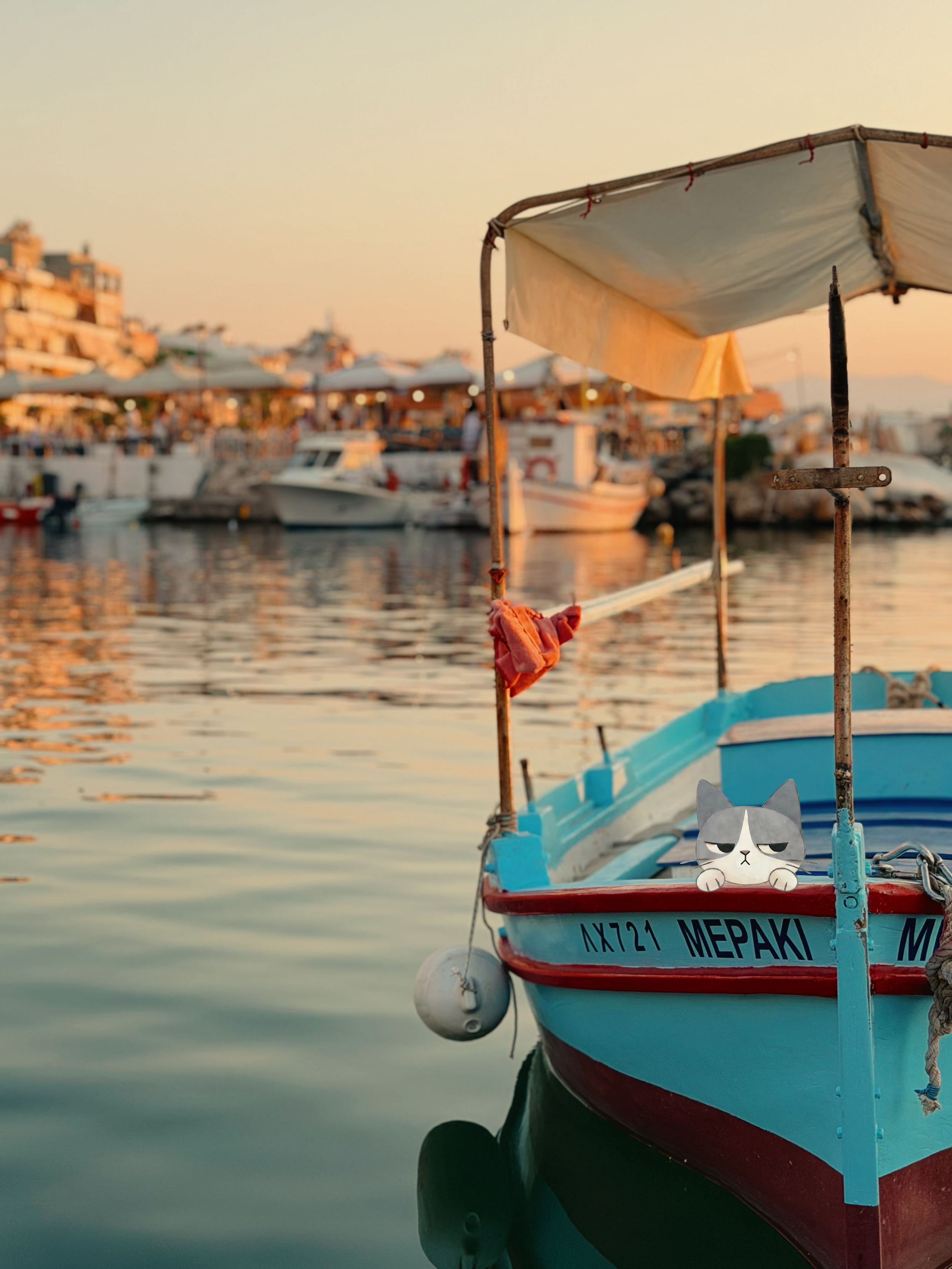 A small Greek boat, floating in calm water during sunset, with Aegey on the bow.
