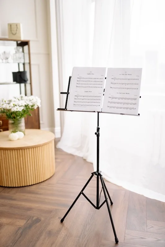 A music stand with sheet music on it.