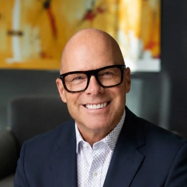 david ott headshot smiling in white shirt with dark suit