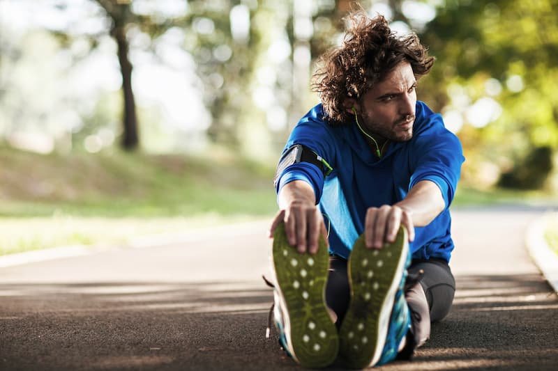 a man stretching before a run
