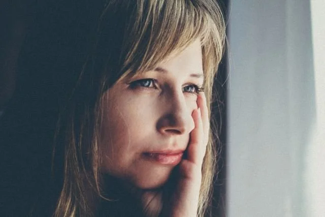A woman looking out the window