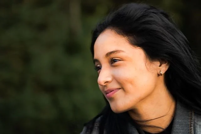 a latino woman smiling