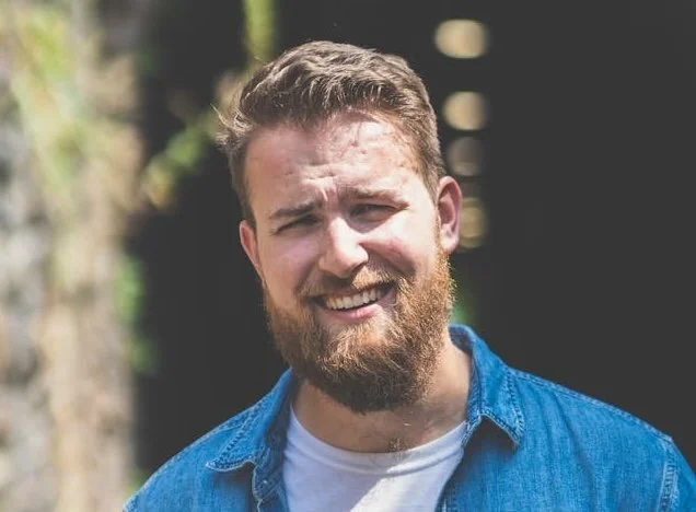 smiling guy with a beard
