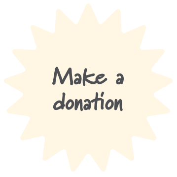 A starburst-shaped sign with the message 'Make a donation' written in black text.